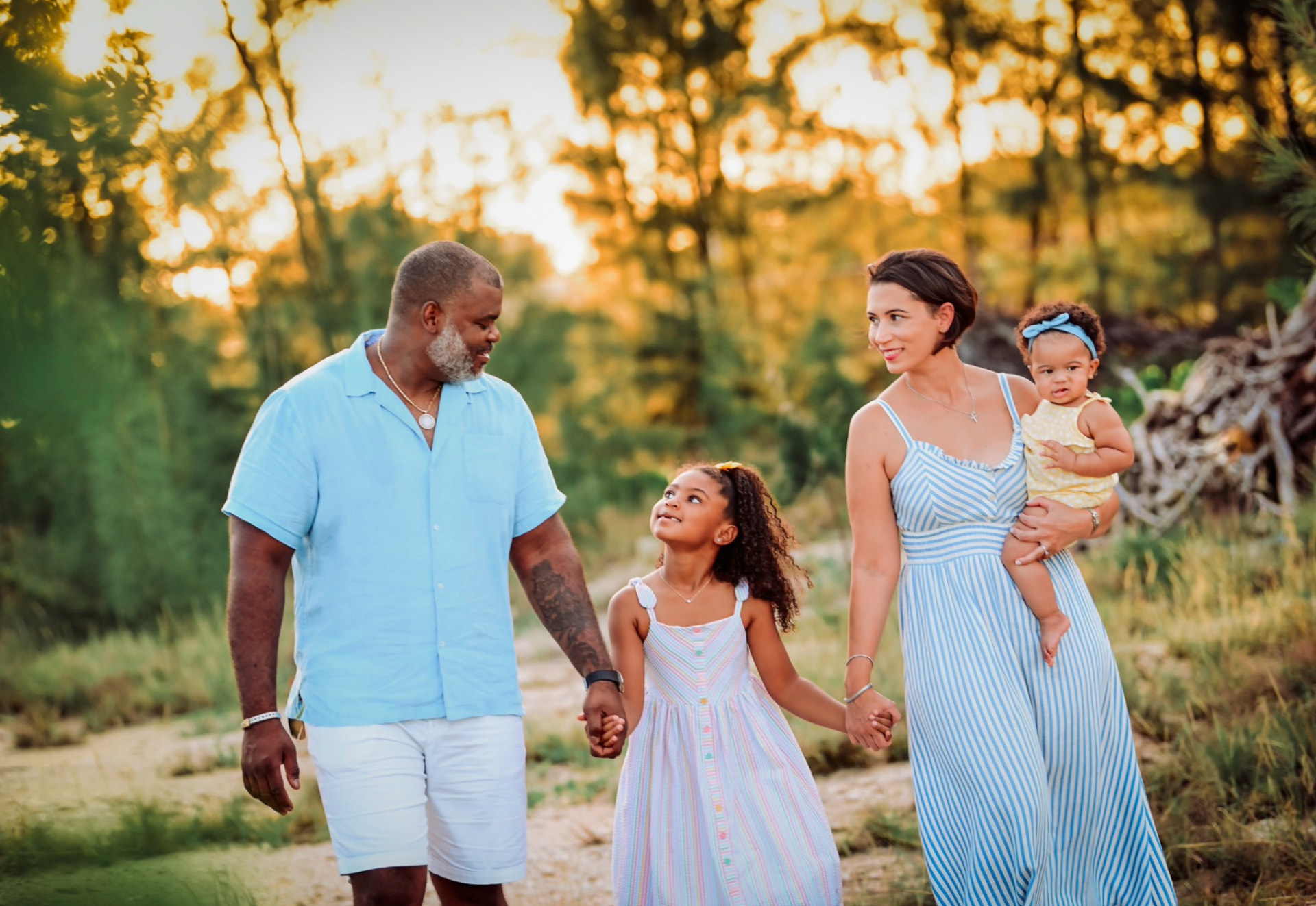 Family walking together in golden island light