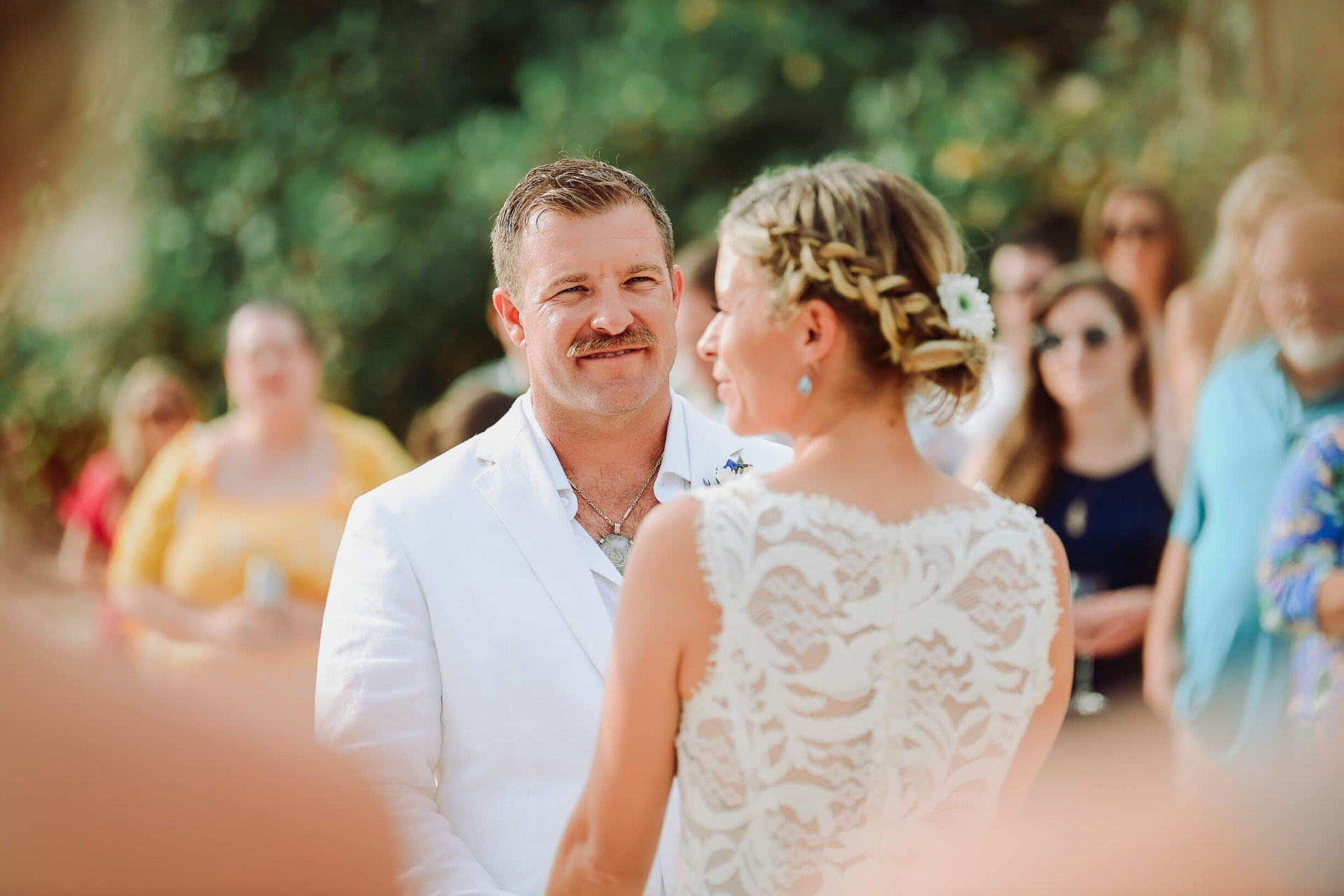 Couple exchanging vows at an intimate island wedding